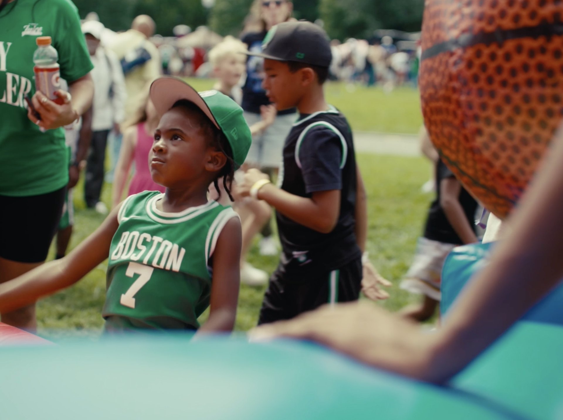 A kid in a Celtics #7 jersey at the festival