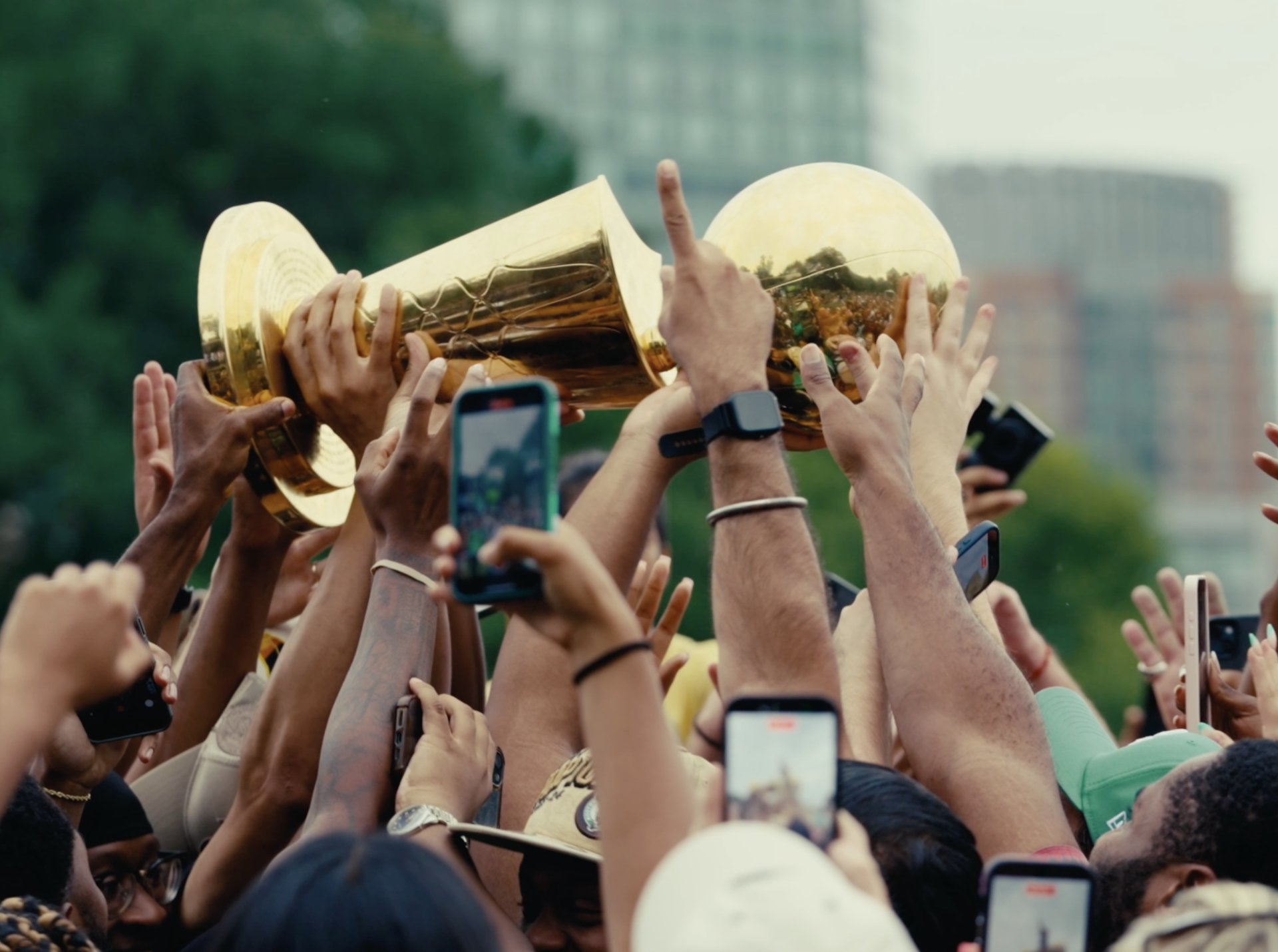 The NBA championship trophy held aloft by the crowd