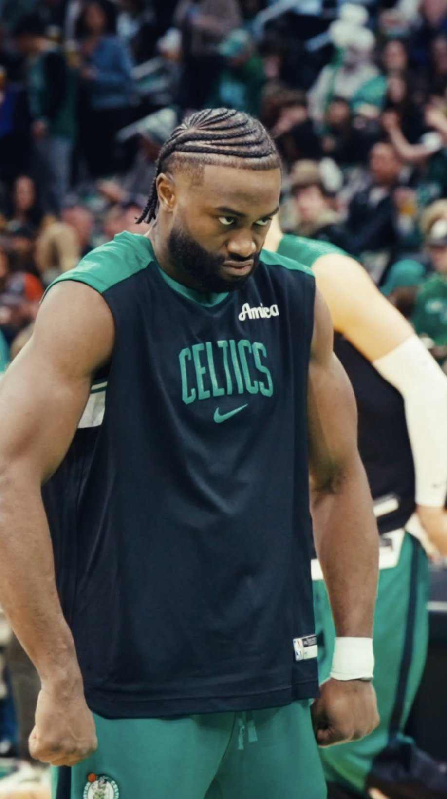 Close-up of Jaylen Brown in a Celtics uniform, head down