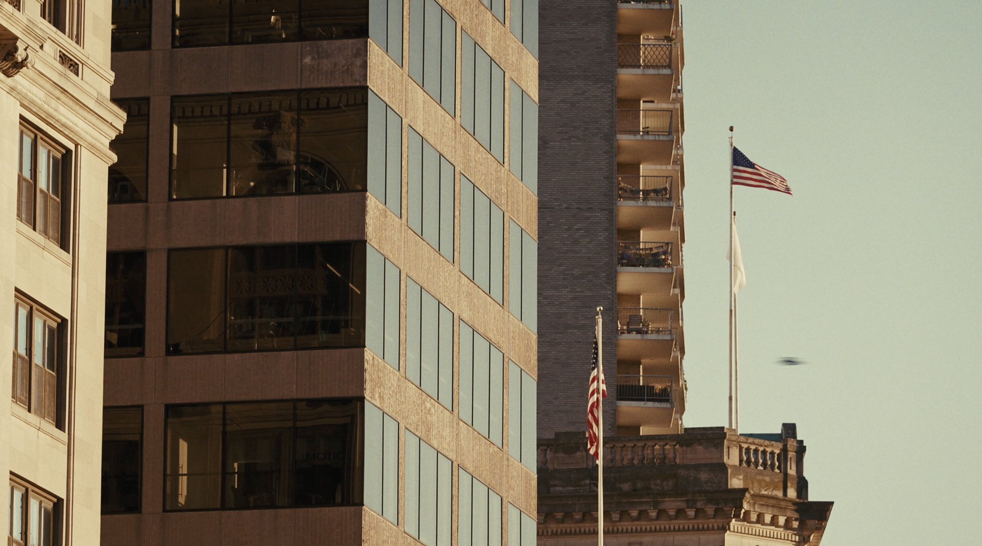 City skyline with an American flag at golden hour